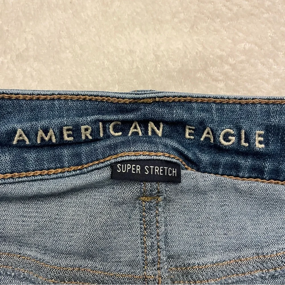 American Eagle High Rise Distressed Mini Jean Skirt.  Size 6